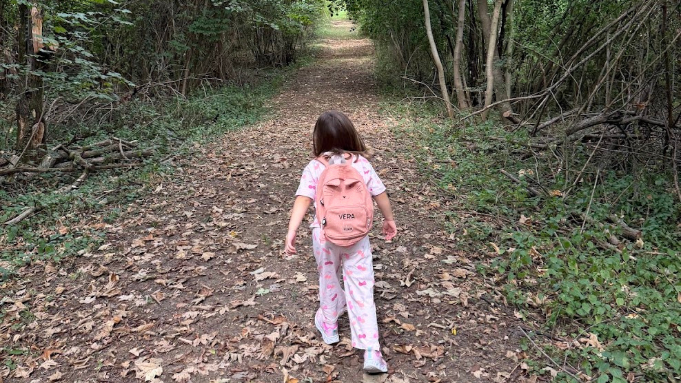my daughter walking in the forest